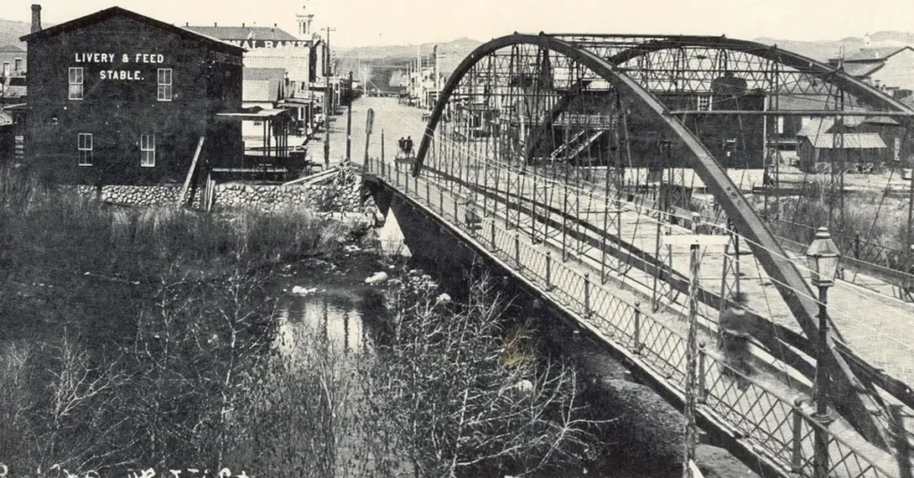 Massage and wellness in Reno NV with a view of the historic bridge and early downtown buildings along the Truckee River