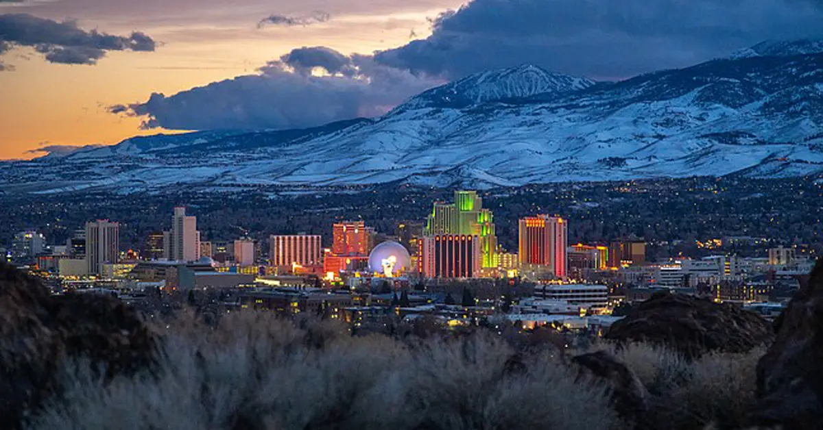 Massage therapy in Reno NV with the downtown skyline at sunset
