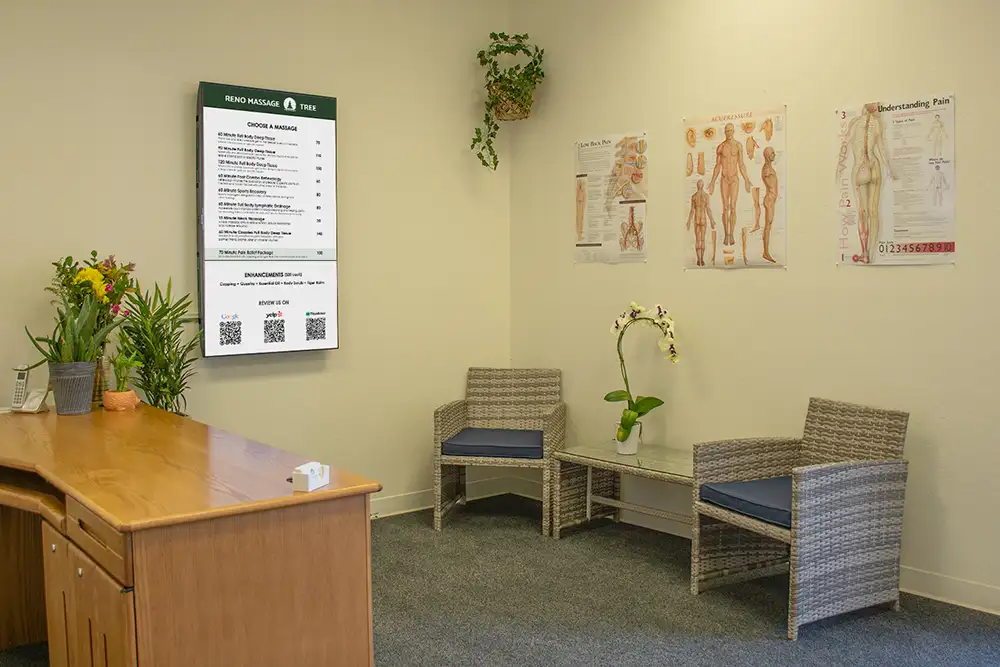 Reno Massage Tree reception area with service menu and seating in a calm professional massage studio in Reno NV