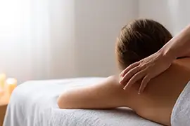 Massage therapist easing shoulder tension during a stress relief massage at Reno Massage Tree in Reno, Nevada